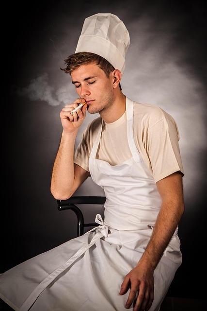 chef plating seasonal dish in restaurant kitchen